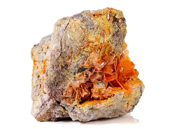 Macro stone mineral Wulfenite on a white background