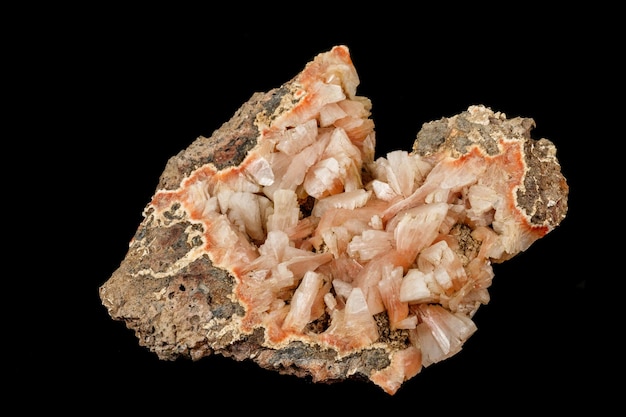 Photo macro of a stone stilbite mineral on a black background