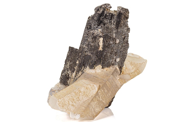 Macro of a stone wolframite mineral quartz fluorite on a white background