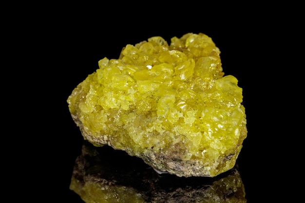 Macro of a sulfur mineral stone on a black background