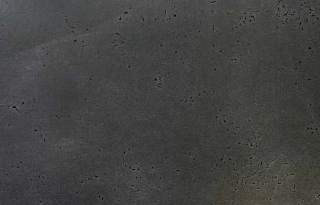 Macro texture of dark brushed scratched metal