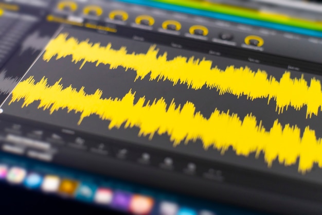 Photo a macro view of the computer monitor screen with sound audio wave graph volume