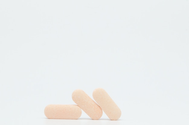 Macro view of pill or tablet isolated over white background