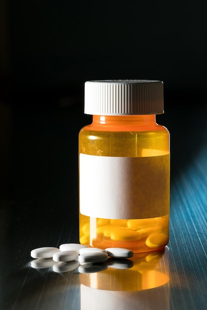 Macro of white tablets on metal table