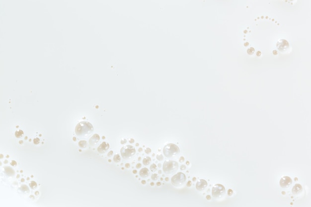 macromelktextuurWit oppervlak van melk en bubbels en rimpelingen van bovenaf vogelperspectief