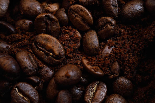 Macrophotography is mixture of coffee beans and ground coffee view from above Promotional backdrop of roasted coffee