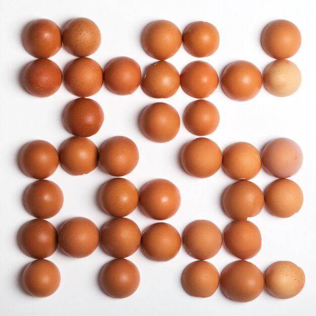 Made of brown eggs on white surface