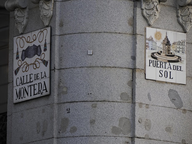 MADRID, SPAIN - DECEMBER 14, 2022: Street name Puerta del sol sign on in Madrid, capital of Spain renowned for its rich repositories of European art.