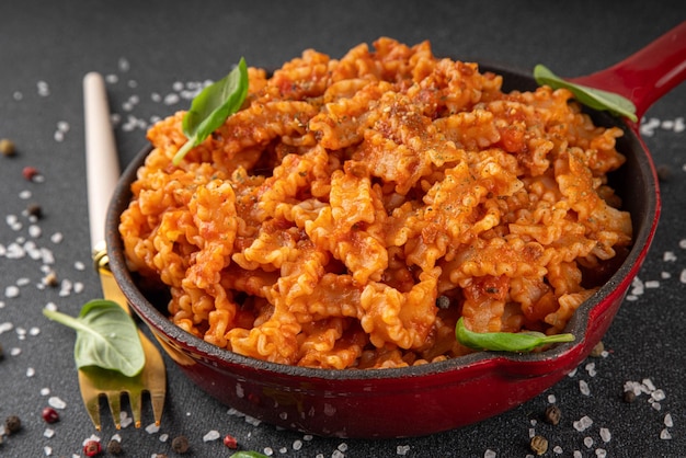 Mafaldine pasta with bolognese tomato sauce