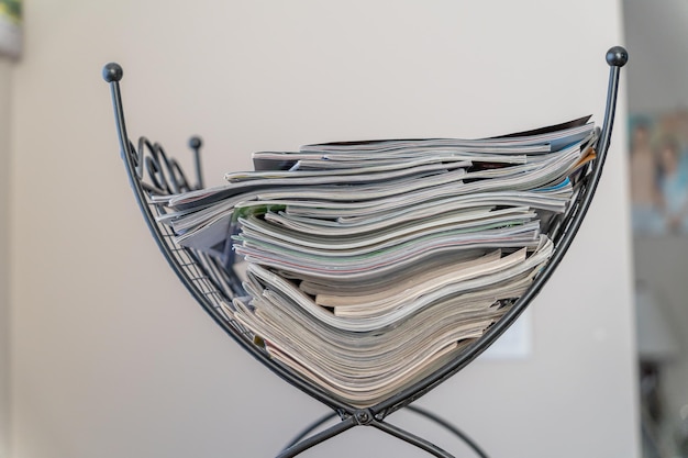 Magazine rack filled with collection of magazines to read