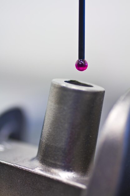 magenta cmm programming lab probe approaching part for inspection closeup