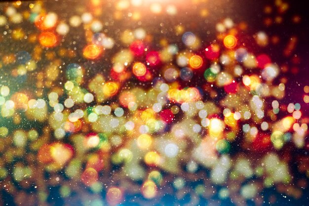 Magic Background With Color Festive background with natural bokeh and bright golden lights.