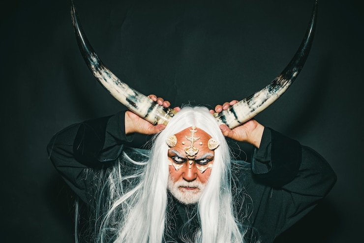 फोटो magic and fairy tale concept man evil with horns monster with sharp thorns and warts on face mysteri