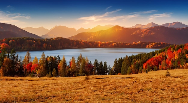 Magical fairytale landscape in autumn with a big lake and the sun in the background with a beautiful sunset in high resolution