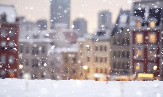 Magical winter snow fall and city lights blurred background city street with Christmas