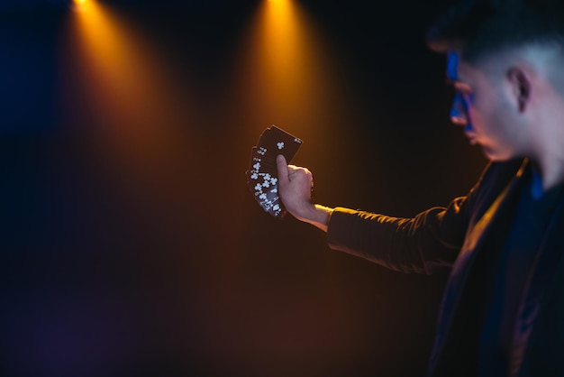 Magician doing a card trick. black cards