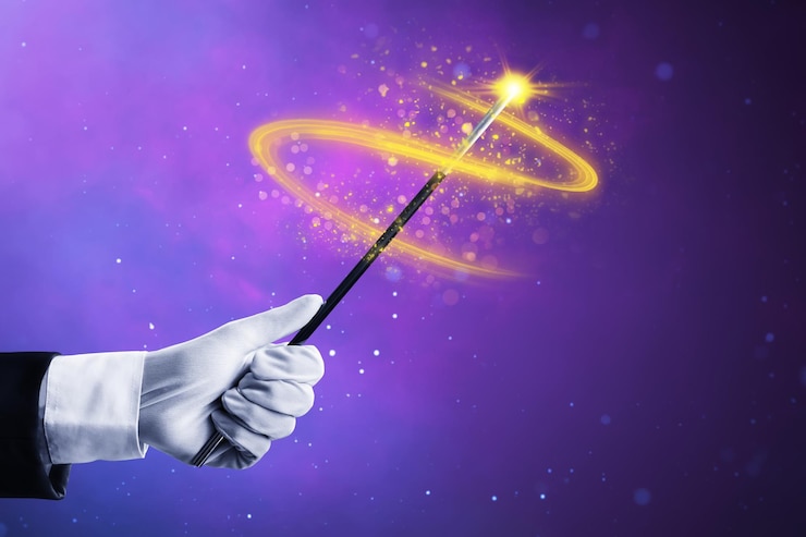 Photo magician hand holding magic wand