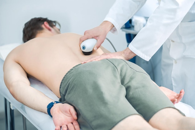 Magnet therapy Man lying on a couch during a session of magnet therapy