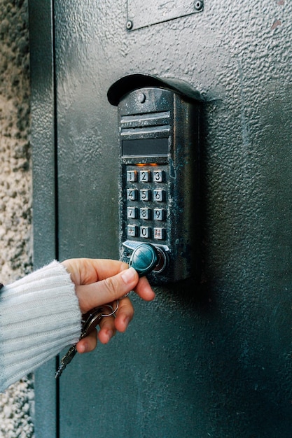 Magnetic intercom in an apartment building opening the front door lock with a magnet