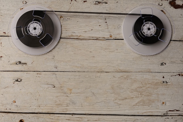 Magnetic tape on old wooden background