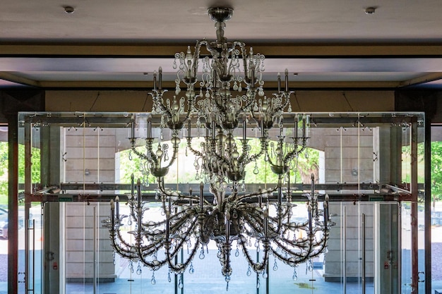 Magnificent baroque chandelier hangs on the ceiling