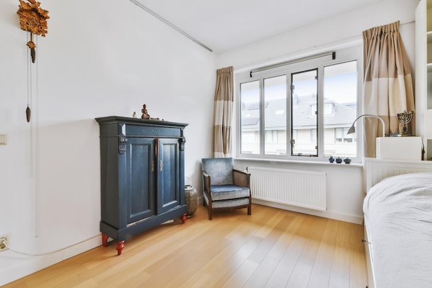 A magnificent room with a black chest of drawers