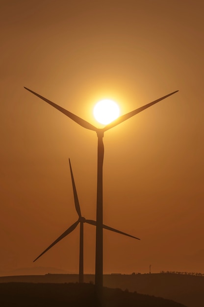 Magnificent sunset behind the wind turbines