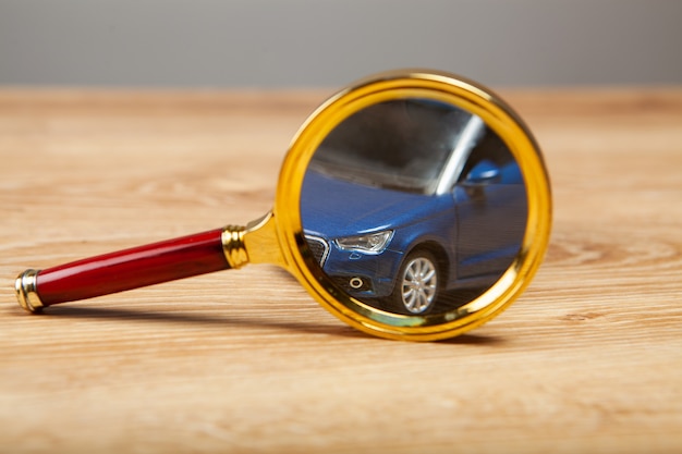 Magnifier and car on the table