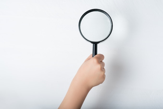 Photo magnifier in a children's hand