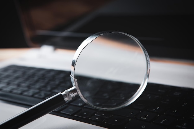 Magnifier on laptop web search concept