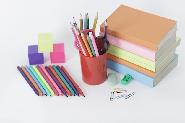 Magnifier paper clip and school supplies on white background photo with copy space