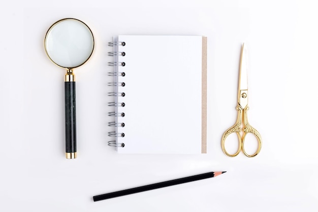 Magnifier scissors and notepad