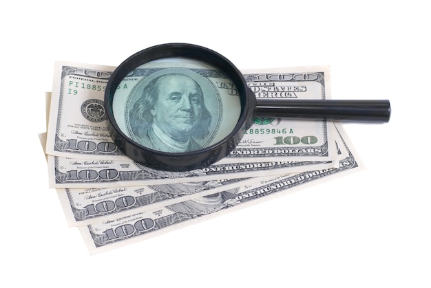 Magnifier with dollars isolated