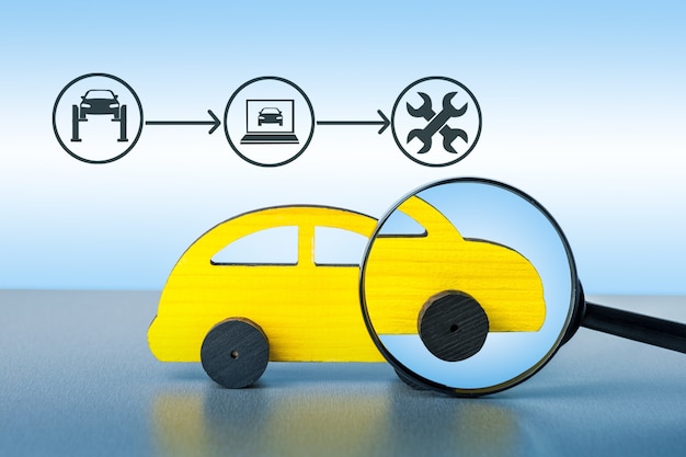 Magnifying checking up the car with car service diagram. Car service concept.