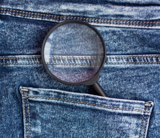 magnifying glass in the back pocket of jeans.