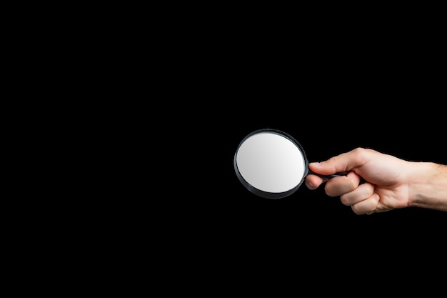 Magnifying glass on a black background