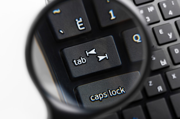 Magnifying Glass on black keyboard