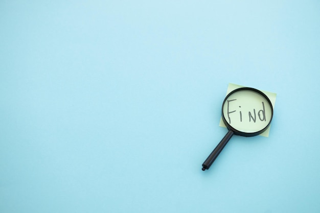 Magnifying glass on blue background Search concept