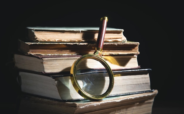 Magnifying glass and book. Education