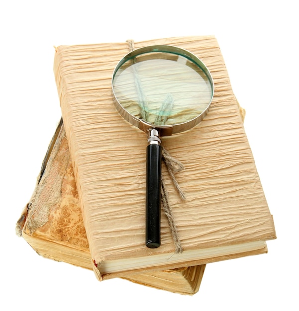 Magnifying glass and book isolated on white