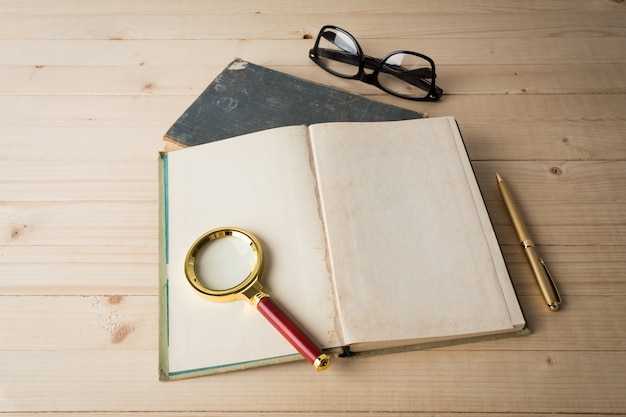 Magnifying glass and book