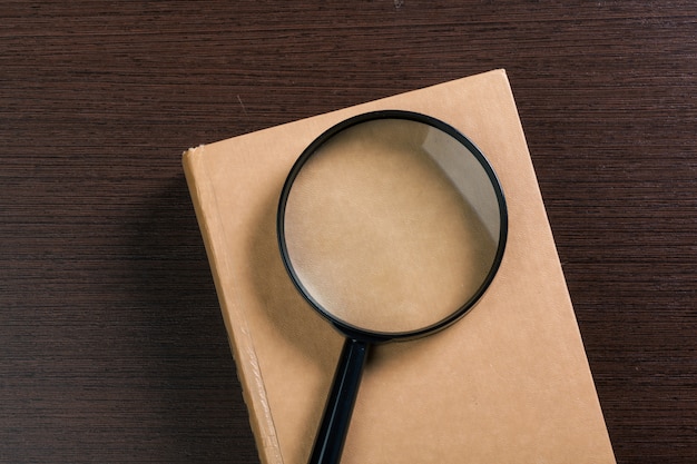 Magnifying glass and book