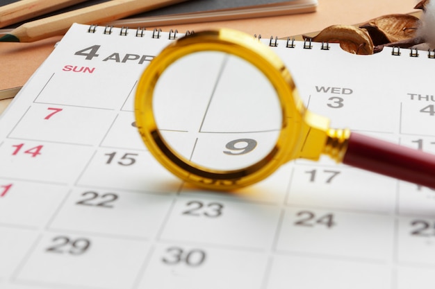 Magnifying glass and calendar