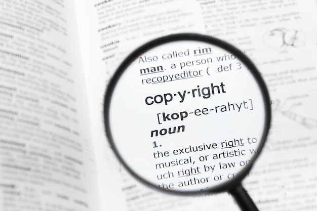 Magnifying glass over the definition of "copyright"