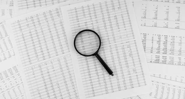 Magnifying glass on financial statement