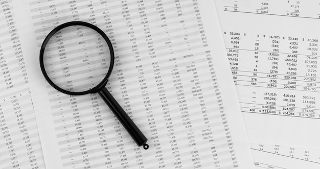 Magnifying glass on financial statement