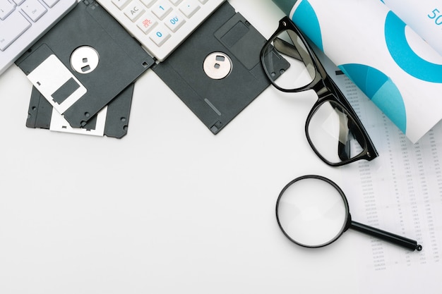 magnifying glass and floppy disk 