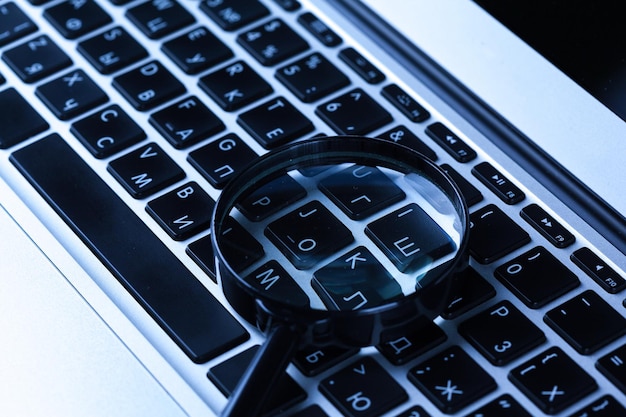 magnifying glass on laptop computer