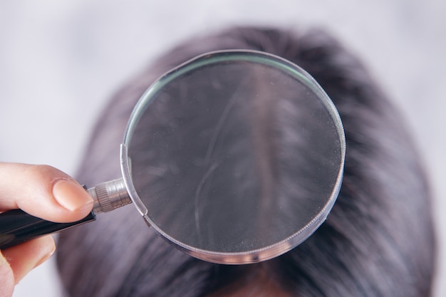 Photo magnifying glass looking at hair