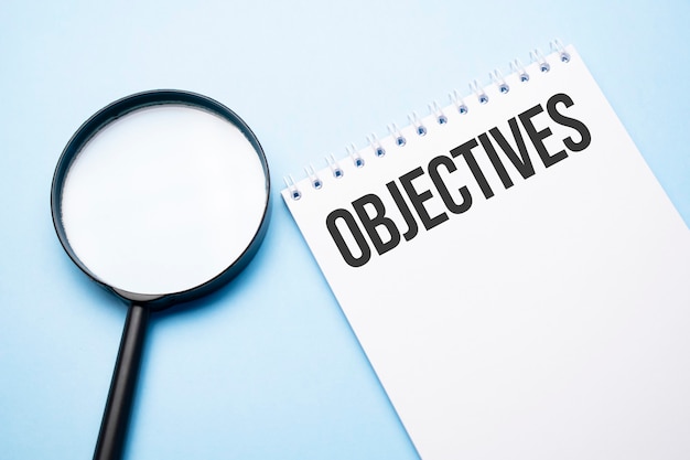 Magnifying glass loupe with sign objective blue table.